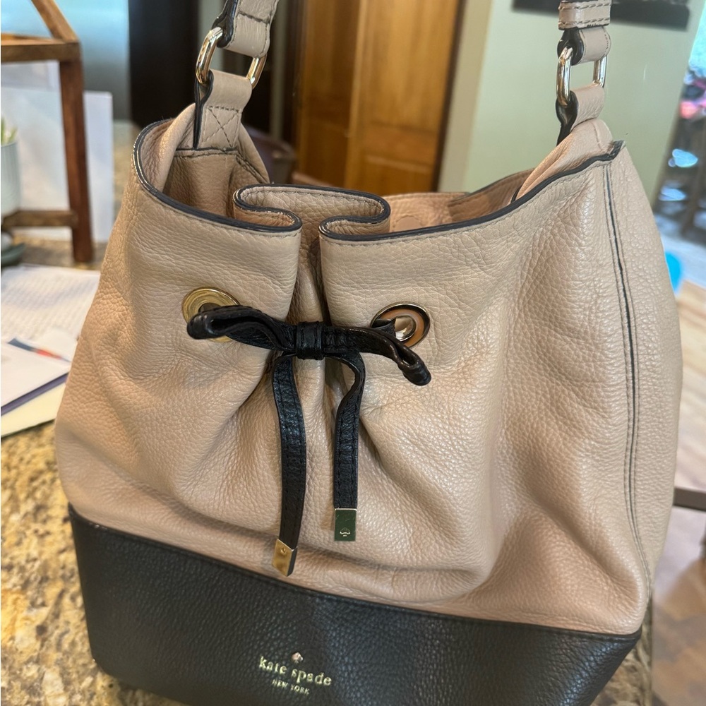 Kate Spade New YorkTan and Black Leather Bucket Bag outside near perfect shape